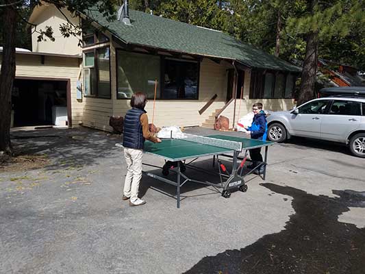 Playing table tennis outside of the lodge